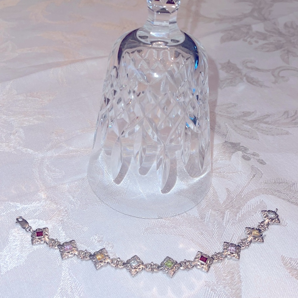 Sterling silver bracelet w/ semi precious gemstones.  7.5” with lobster clasp.